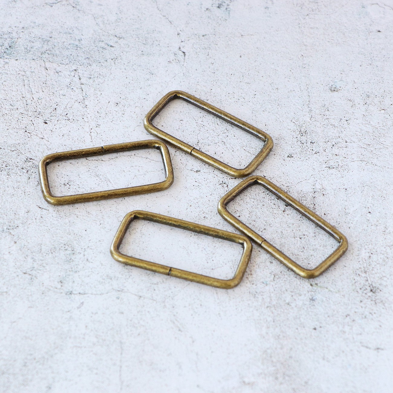 Four 2in Rectangle Rings Antique